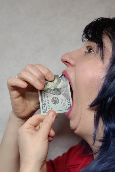Woman puts bill inside mouth