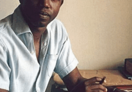 BREAKING: Rare Photos Of Chinua Achebe Showing Off His Book “Things Fall Apart” In 1960