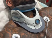 Holston was filmed through a window as he laid in a bed with a neck brace while his leg was also wrapped up