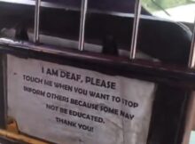 I am deaf, please tap me when you want to stop  passenger shares touching notice a Keke driver placed in his tricycle